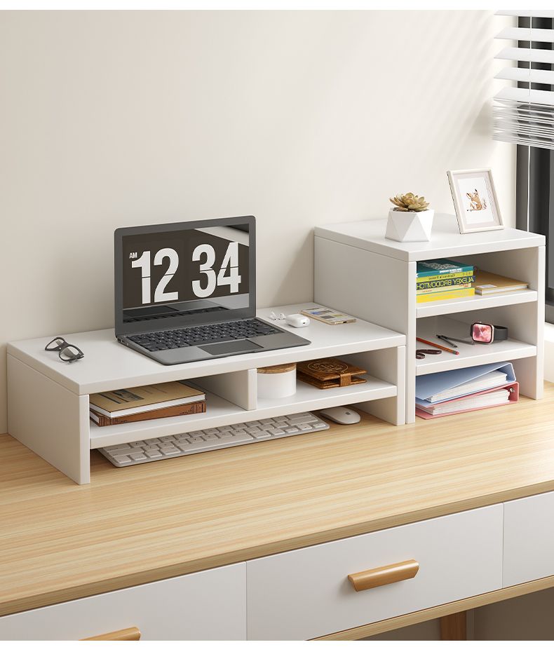 White dual-tier desk organizers with a laptop and office supplies on a light wood desk