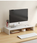 White computer monitor stand on a wooden desk with an iMac and office accessories