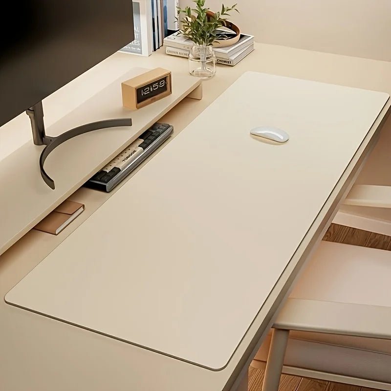 Large cream-colored desk mat on a minimalist white workspace with a mouse and keyboard