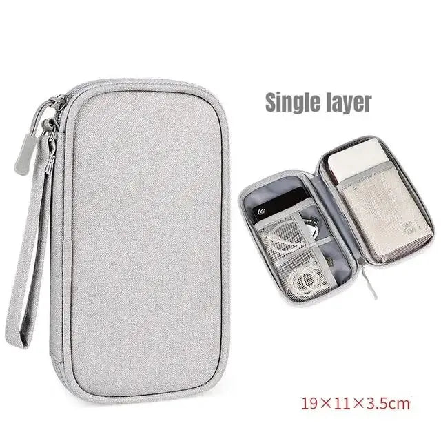 Grey single layer travel cable organizer pouch with interior storage and dimensions