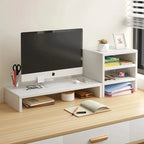 White wooden desk organizer with monitor riser and tiered storage shelves on a light wood desk.