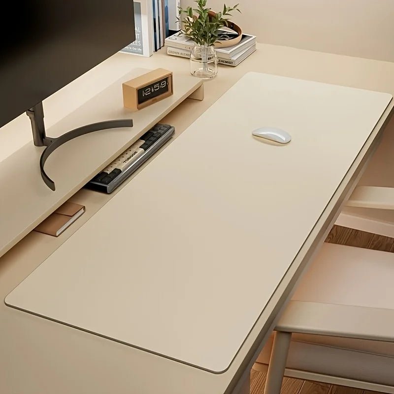 Beige large desk mat on a white workspace with a keyboard, mouse, and monitor.