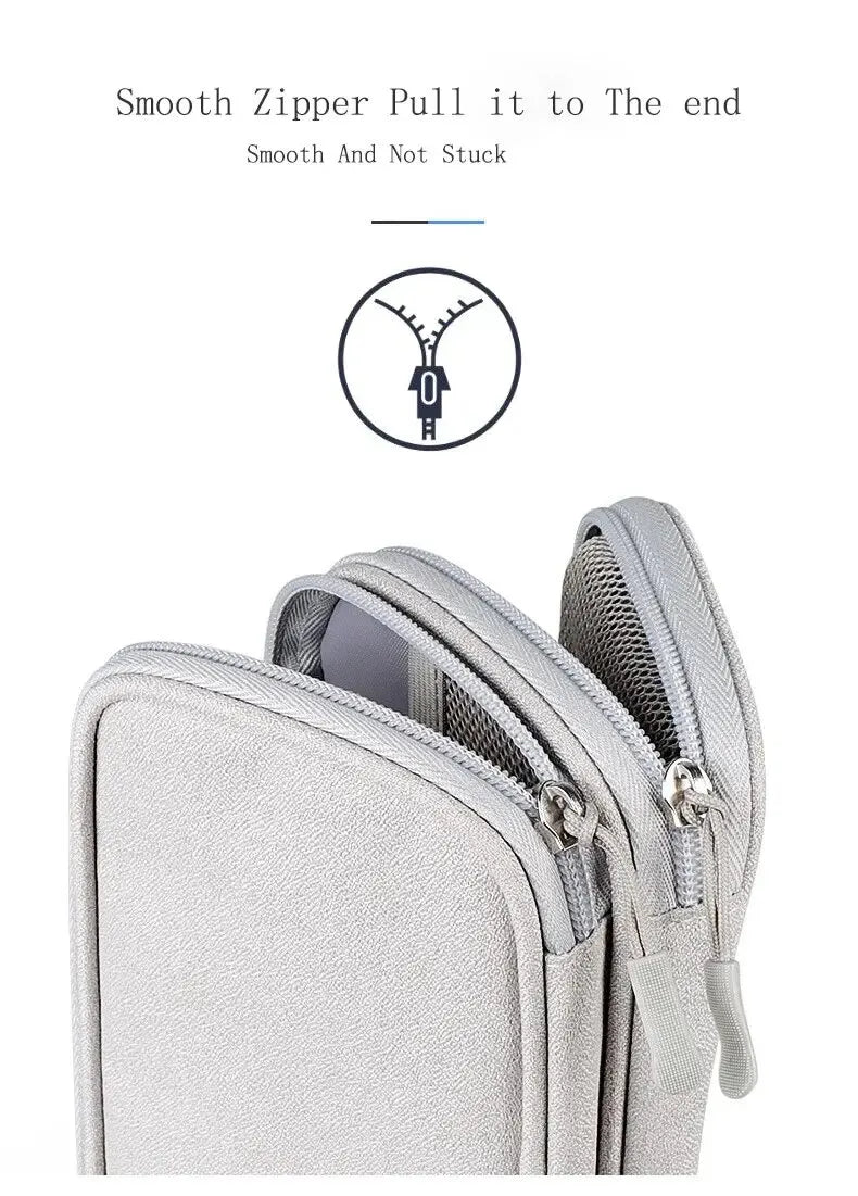 Close-up of smooth zippers on a silver grey tech organizer case.