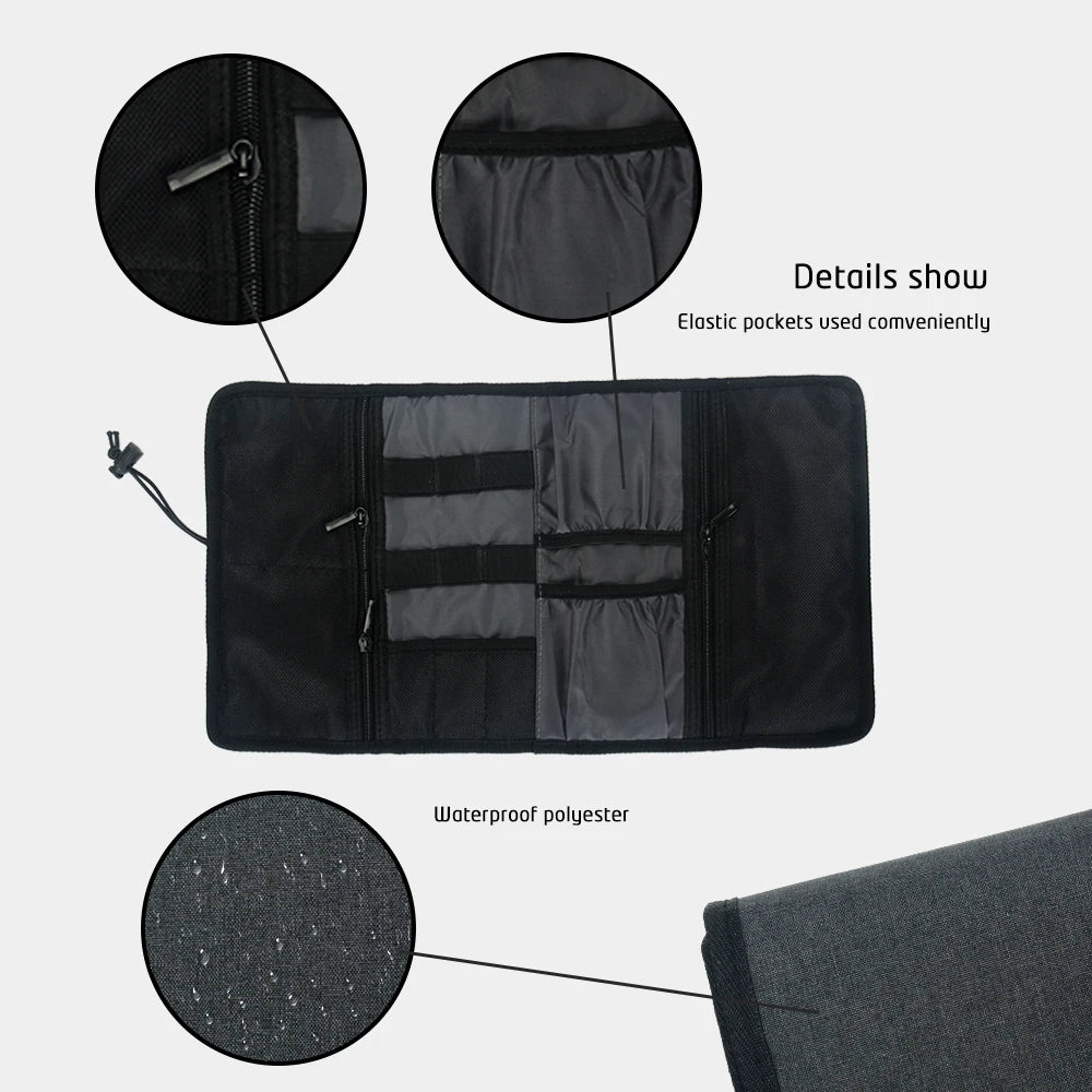 Black waterproof polyester tech organizer with elastic pockets and zipper closures.