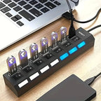 LOBKIN multi-port USB hub with individual power switches connected to a laptop