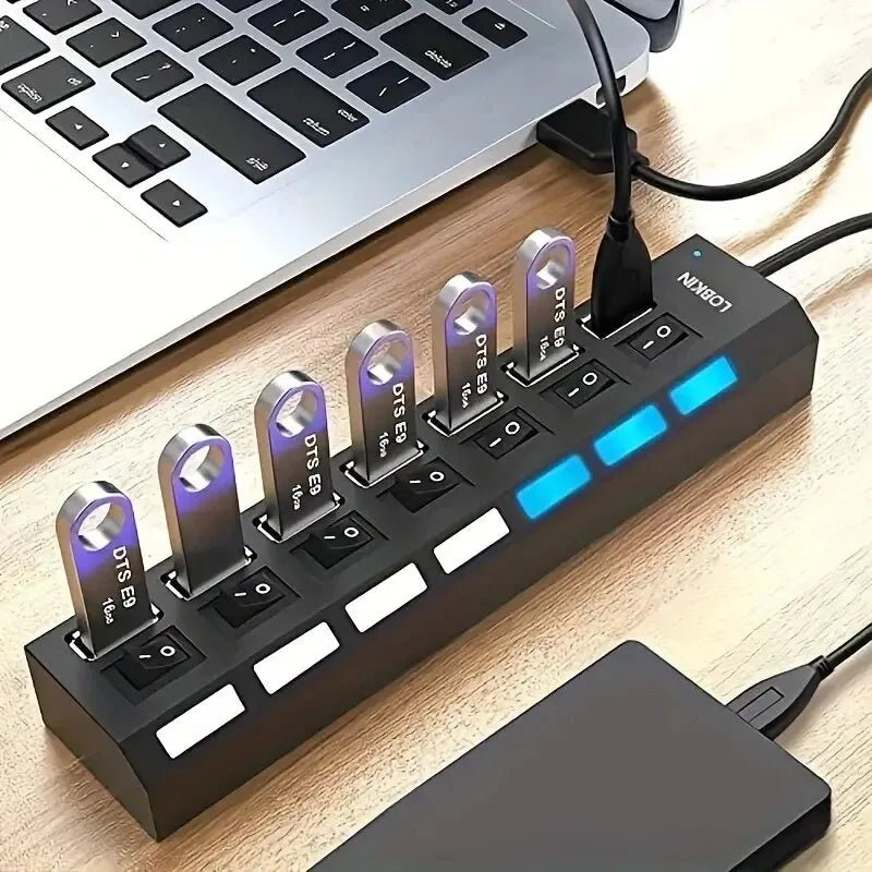 LOBKIN multi-port USB hub with individual power switches connected to a laptop