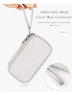 Light grey travel organizer pouch with lanyard for portable electronics storage