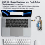 USB 3.0 hub connected to a laptop with an external keyboard and mouse.