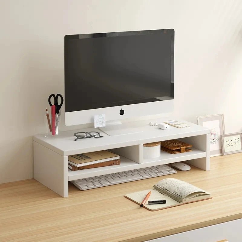 White monitor riser stand with storage shelves on a wooden desk holding an iMac and office supplies