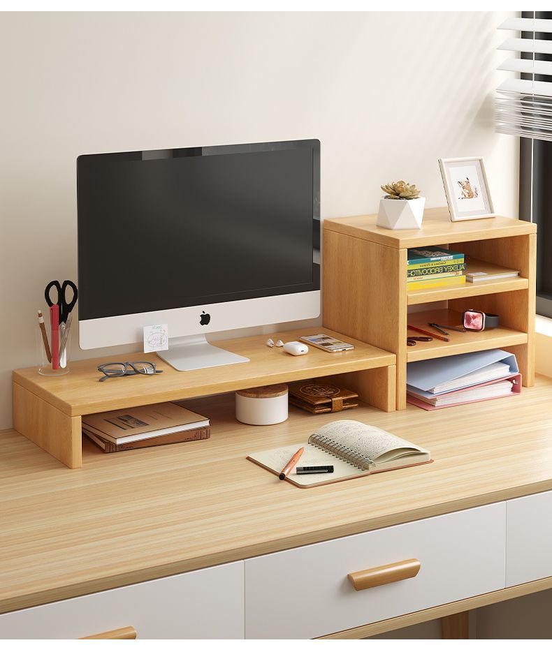 Wooden desktop monitor stand and organizer on a light wood desk with an iMac.